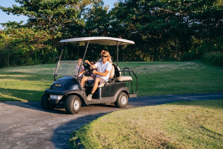 A man driving a golf cart